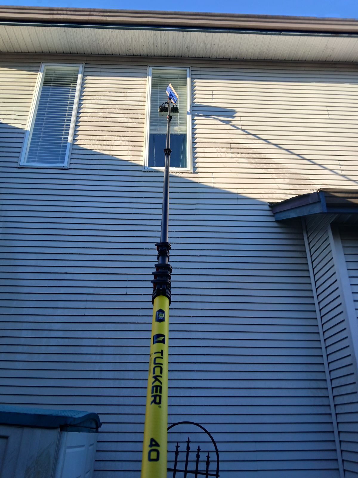 Tucker water-fed pole cleaning residential windows